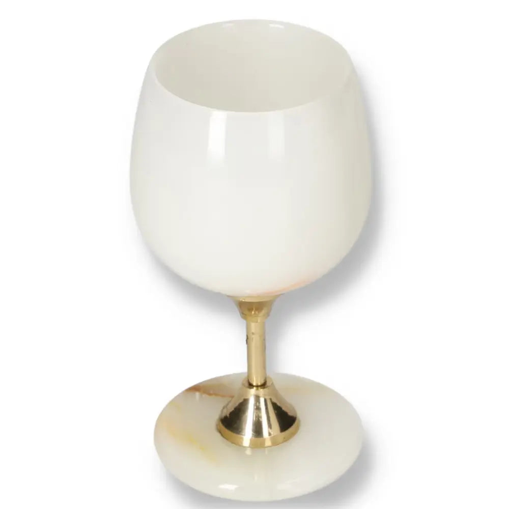 Elegant onyx wine glass with a gold stem, showcasing unique off-white color and veining. Perfect for sophisticated occasions.