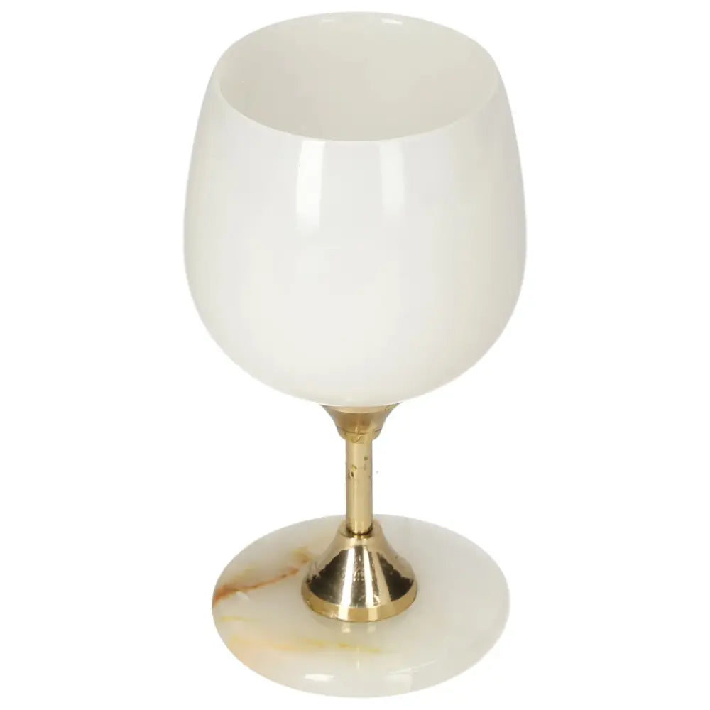 Elegant off-white onyx wine glass with gold stem, showcasing unique veining and polished surface for sophisticated occasions.
