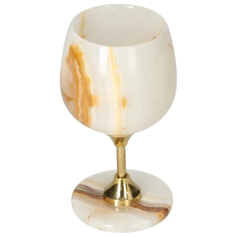 Exquisite onyx wine glass with unique veining and polished surface, crafted from premium off-white onyx for elegant drinkware.