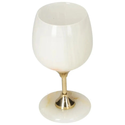 Off-white onyx wine glass with unique veining and polished finish, featuring a sleek design and elegant gold stem.