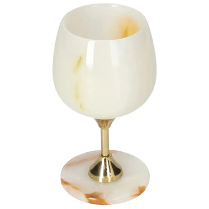 Onyx wine glass with distinct veining and off-white hues, featuring a polished surface and elegant design on a metallic stem.