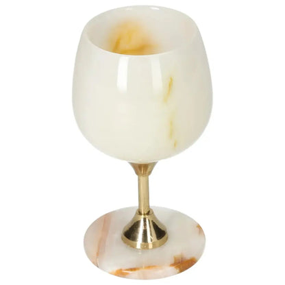 Exquisite off-white onyx wine glass with unique veining, polished surface on elegant stem, perfect for fine drinking occasions.