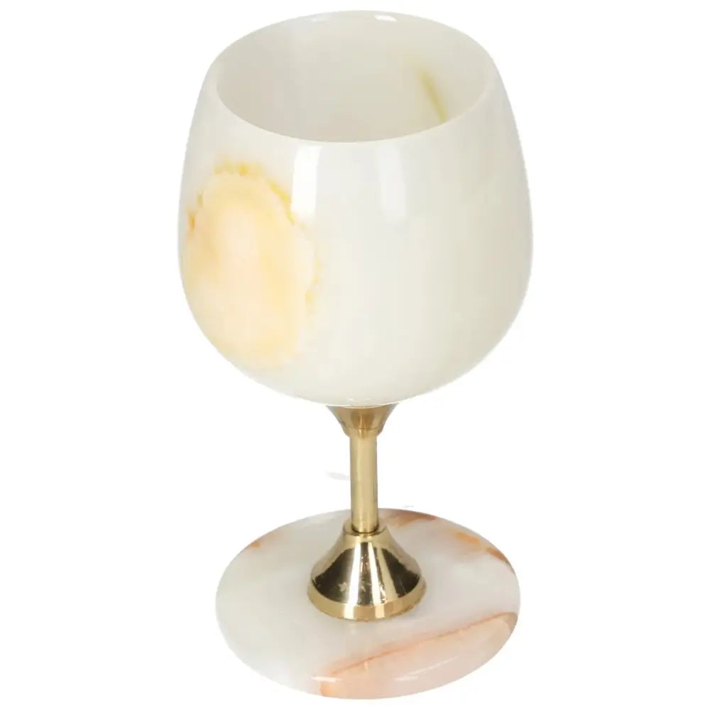 Exquisite onyx wine glass with unique color variations and polished finish, showcasing elegance and sophistication.