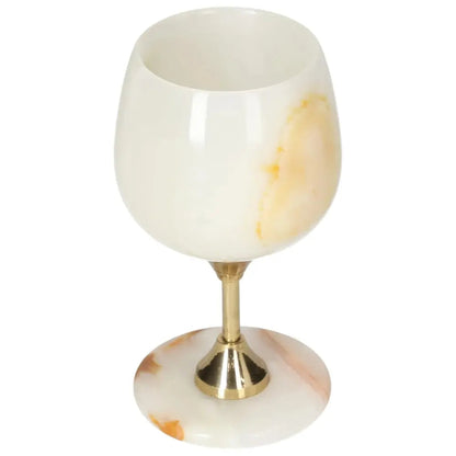 Exquisite onyx wine glass with unique veining, featuring a polished surface and elegant off-white color, perfect for sophisticated occasions.