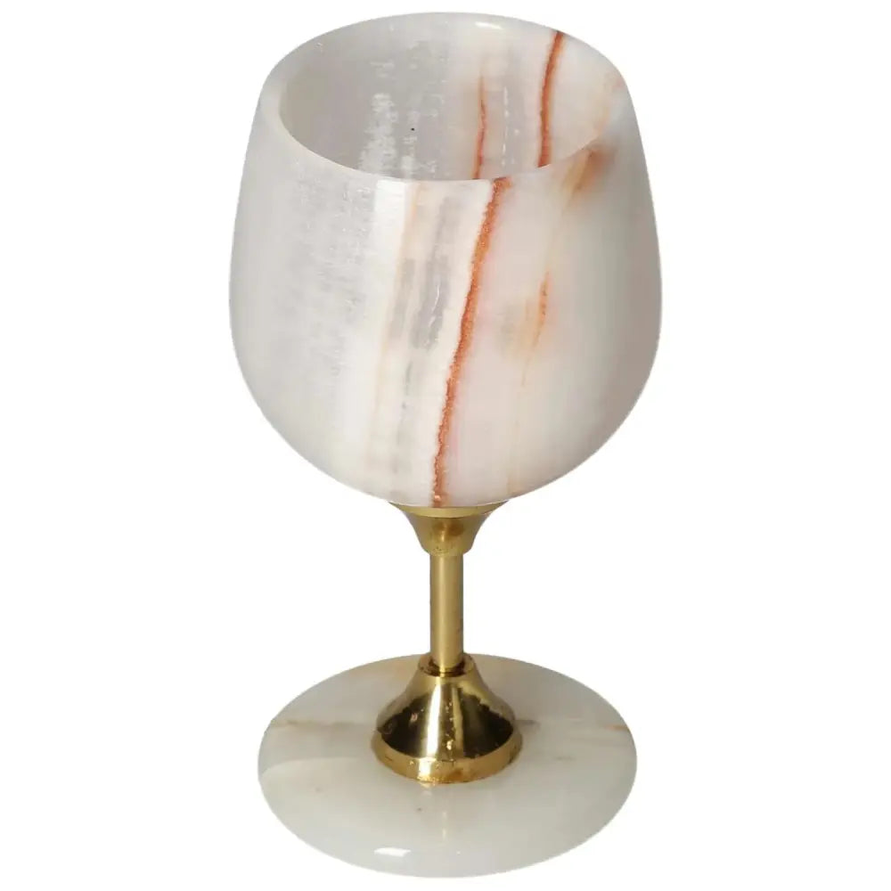 Elegant onyx wine glass with unique veining and polished finish, featuring a sleek gold base. Perfect for sophisticated occasions.