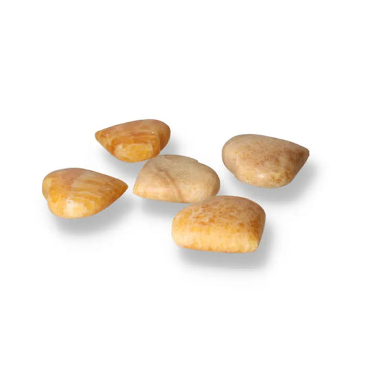 Five heart-shaped orange calcite gemstones symbolizing love and renewal, perfect for crystal enthusiasts seeking emotional balance.