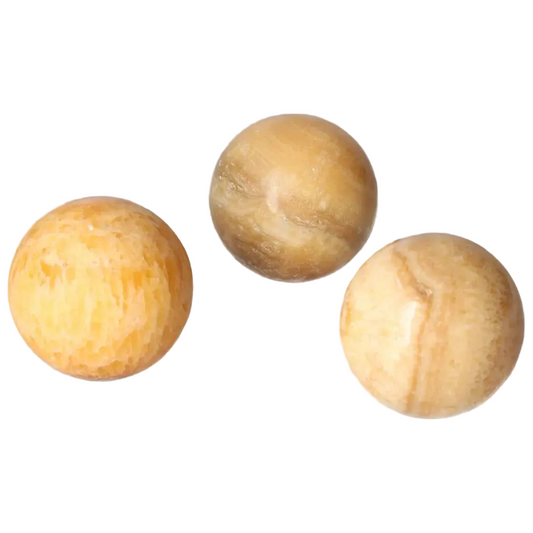 Three polished orange calcite spheres showcasing vibrant, warm colors and smooth, balanced shapes for positivity and creativity.