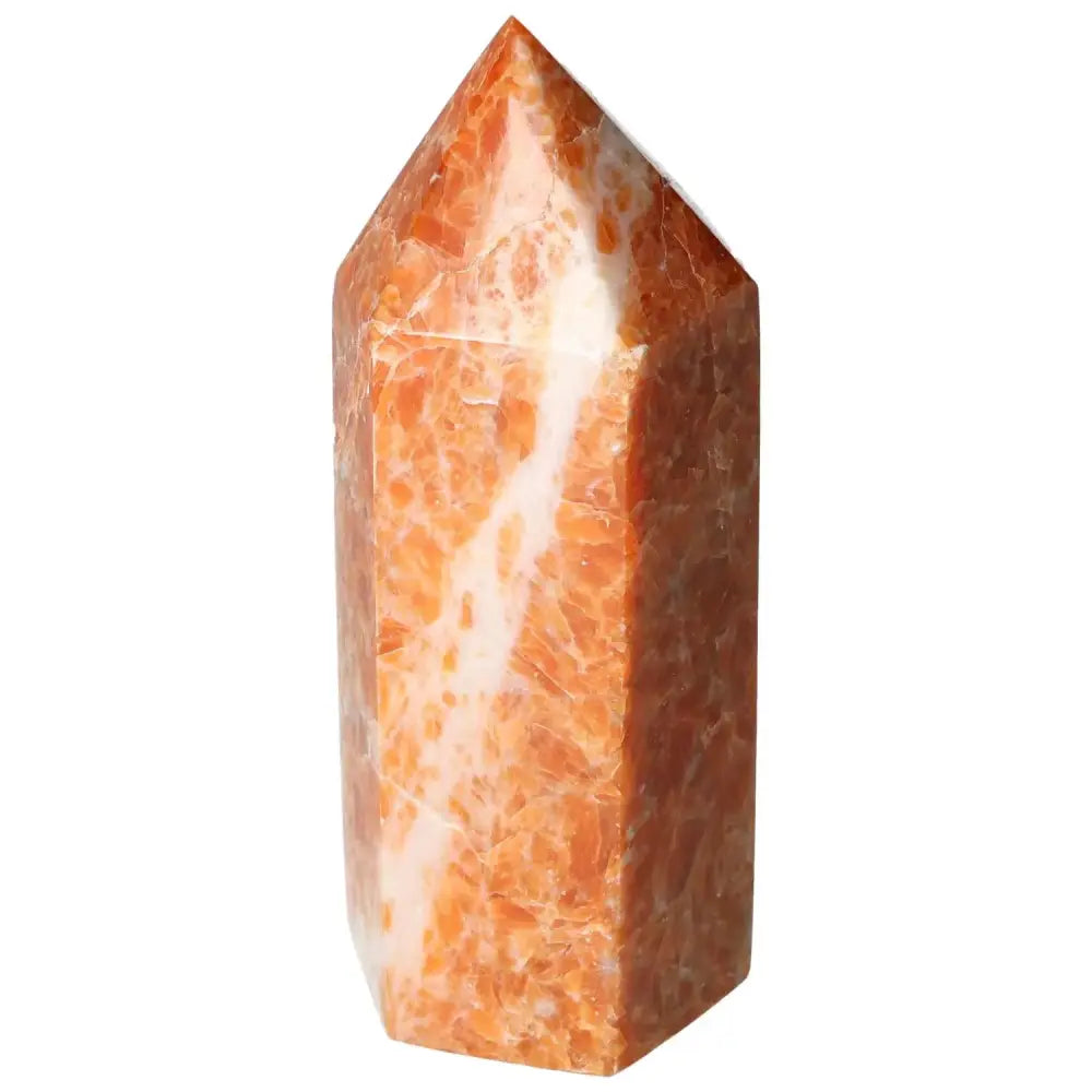 Orchid Calcite Obelisk in warm orange and cream hues, reflecting natural artistry and spiritual energy, handpicked by Sylvia Crystals.