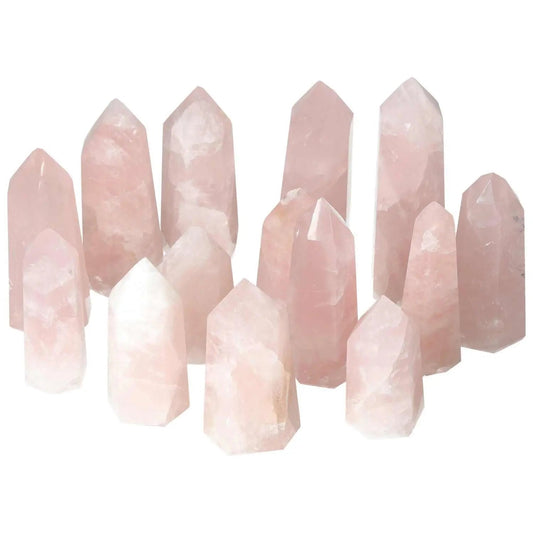 Collection of polished pink quartz obelisks, 1 kg set of 6 pieces, premium quality, showcasing exquisite craftsmanship and natural beauty.