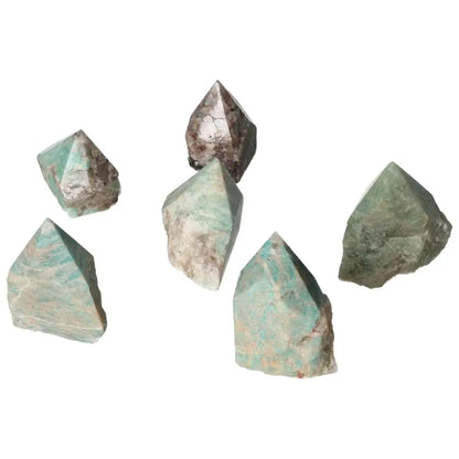 Polished Point Amazonite S crystals from Sylvia Crystals, shown in various shades, promoting harmony and security.