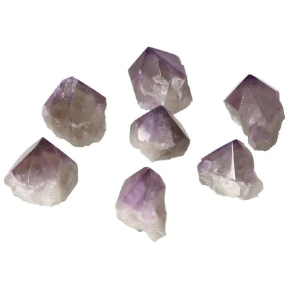 Polished amethyst points from Sylvia Crystals, promoting relaxation and focus with a touch of luxury and spiritual elegance.