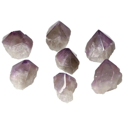 Polished Point Amethyst S clusters from Sylvia Crystals, showcasing premium quality and calming properties for stress relief and concentration.