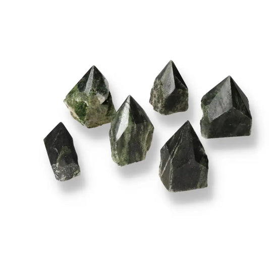 Green Polished Point Diopside S gemstones from Sylvia Crystals, symbolizing luxury and spiritual connection.