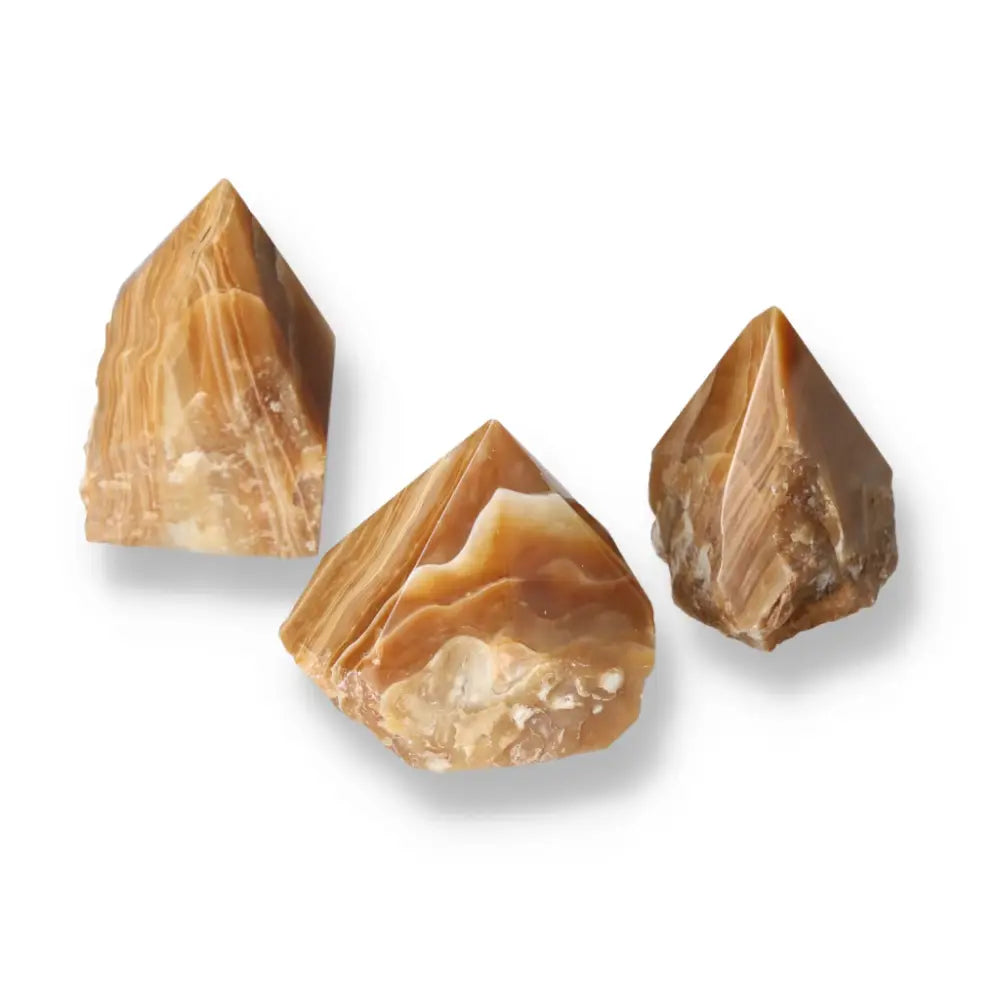 Polished Point Honey Calcite L stones with warm amber hues for prosperity by Sylvia Crystals.