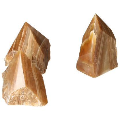 Polished Point Honey Calcite gemstones with warm amber hues, ideal for prosperity and abundance by Sylvia Crystals.