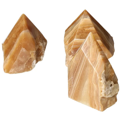 Polished Point Honey Calcite L stones from Sylvia Crystals, showcasing warm amber hues for prosperity and success.