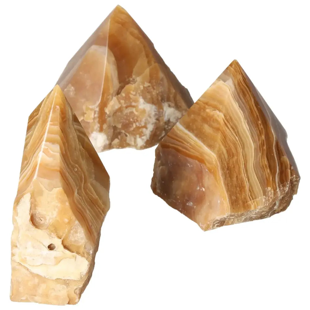 Polished Point Honey Calcite L gemstones with warm amber hues from Sylvia Crystals, symbolizing prosperity and abundance.