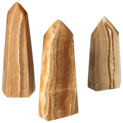 Polished Point Honey Calcite L crystals by Sylvia Crystals, luxurious honey-hued stones for prosperity and success.