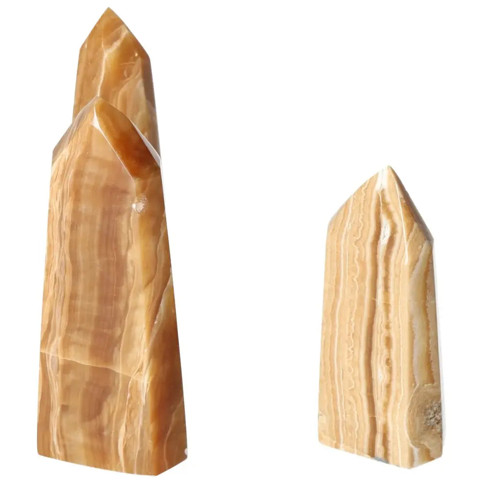 Polished Point Honey Calcite L by Sylvia Crystals, showcasing luxury and prosperity with its smooth, honey-hued surface.