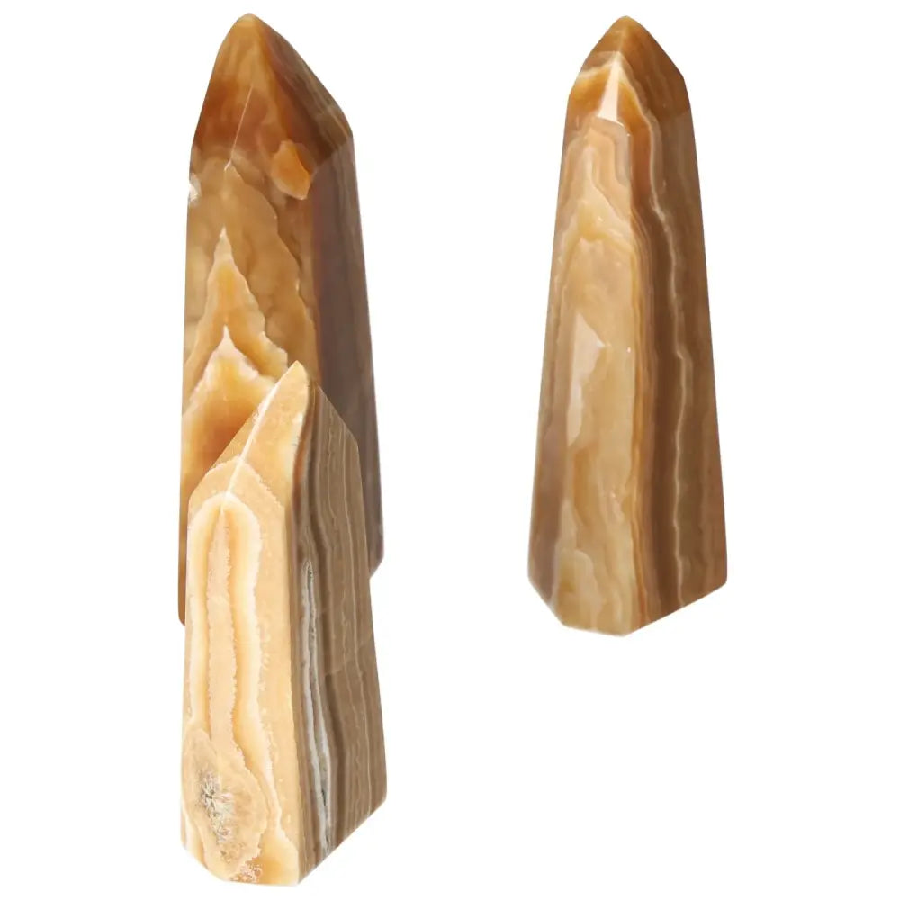 Polished Point Honey Calcite L crystal by Sylvia Crystals showcasing its smooth surface and honey-like hue for prosperity and abundance.