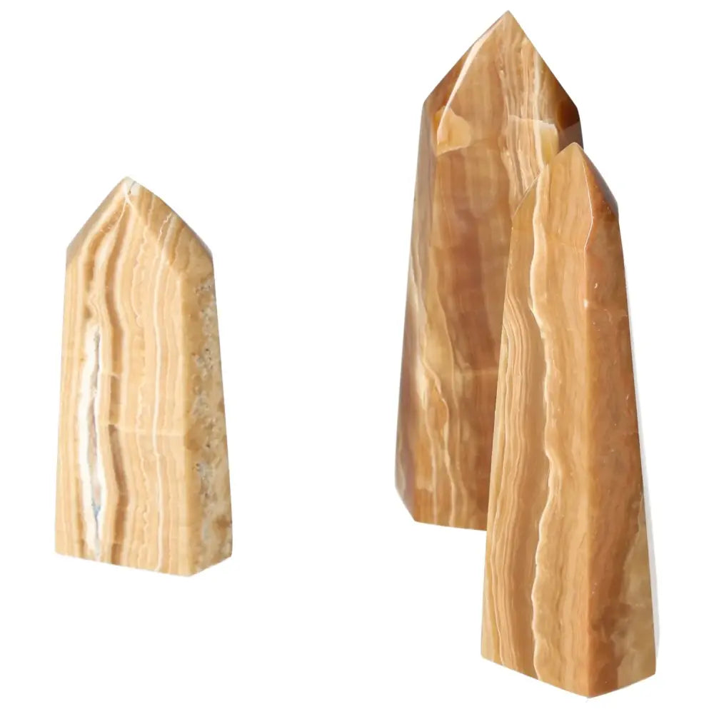 Polished Point Honey Calcite by Sylvia Crystals, featuring smooth, honey-colored surface, symbolizing prosperity and abundance.