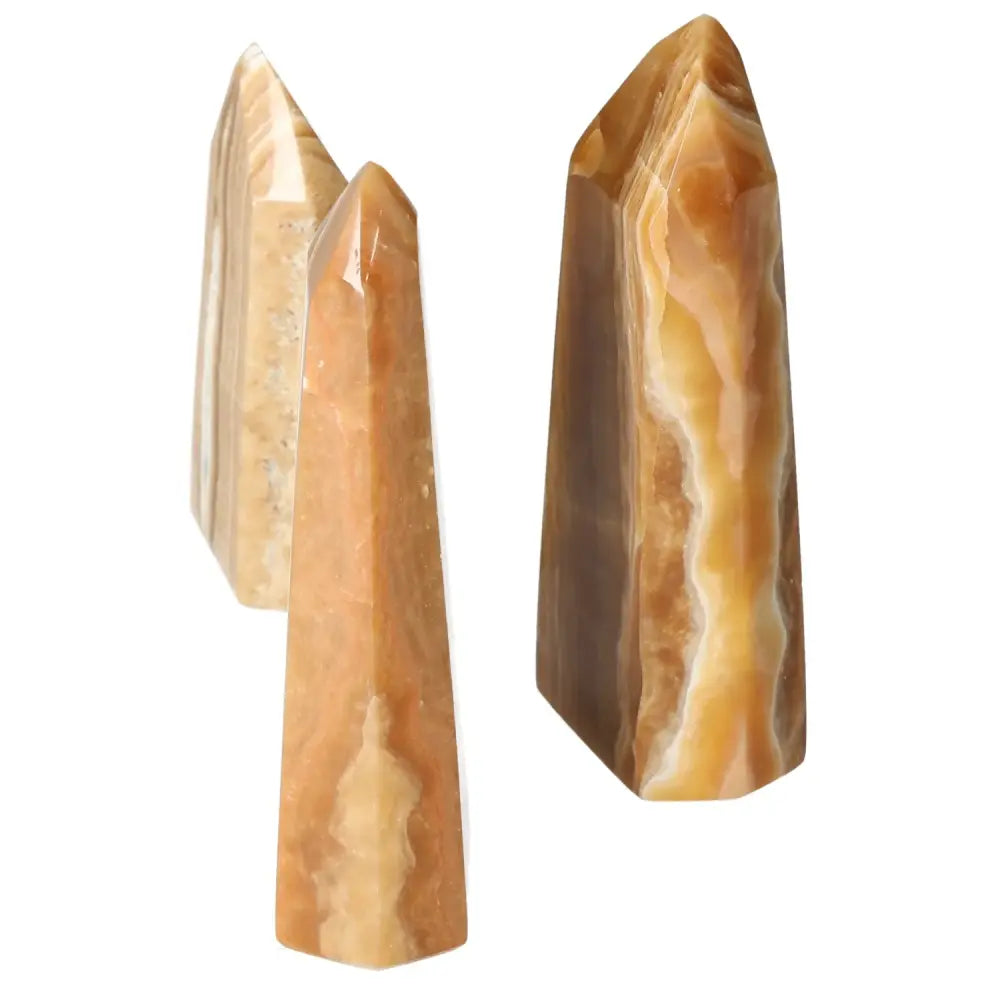 Polished Point Honey Calcite L by Sylvia Crystals, premium decorative crystal, smooth honey hue, prosperity and abundance beacon.