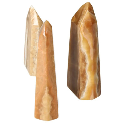 Polished Point Honey Calcite L by Sylvia Crystals, premium decorative crystal, smooth honey hue, prosperity and abundance beacon.