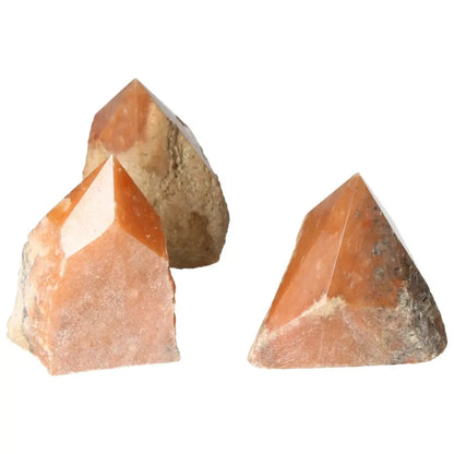 Set of polished point orange calcite bi-color crystals from Sylvia Crystals, showcasing vibrant hues and natural artistry.