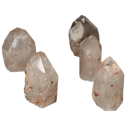 Polished Point Quartz with Hematite crystals, showcasing the natural elegance and transformative energy by Sylvia Crystals.