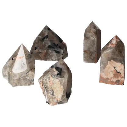Polished Point Quartz with black Tourmaline inclusions, unique gemstones from Sylvia Crystals. Perfect for collectors and crystal enthusiasts.