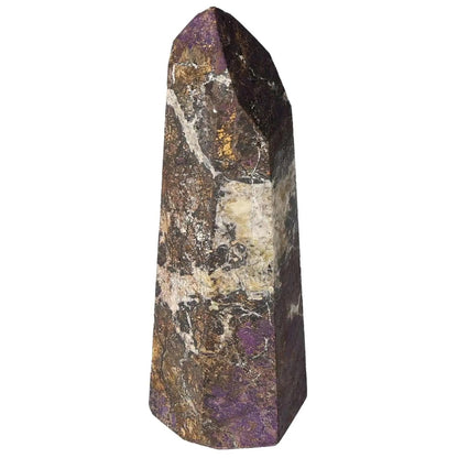 Polished Purpurite Obelisk showcasing vibrant purple and earthy hues, a luxurious piece from Sylvia Crystals blending spirituality and design.