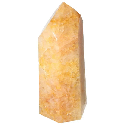 Polished Quartz Orange Obelisk by Sylvia Crystals, known for vibrant energy and luxury, inspiring creativity and warmth.
