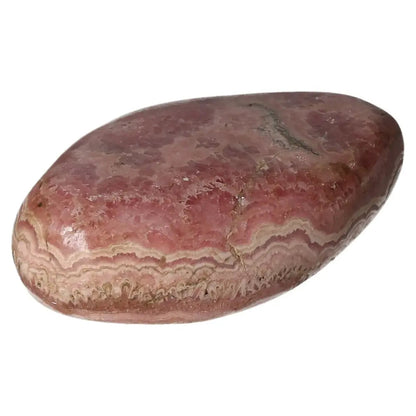 Polished Rhodochrosite crystal with pink hues and intricate banding from Sylvia Crystals, symbolizing love and compassion.