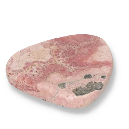 Polished Rhodochrosite gemstone showcasing pink hues and intricate banding, exclusive to Sylvia Crystals.