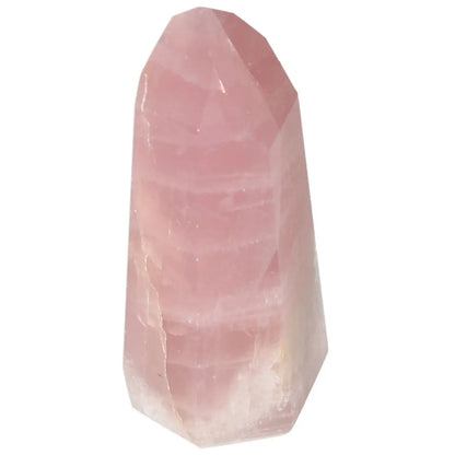 Polished rose quartz obelisk with gentle pink hue, enhancing love and emotional healing by Sylvia Crystals.