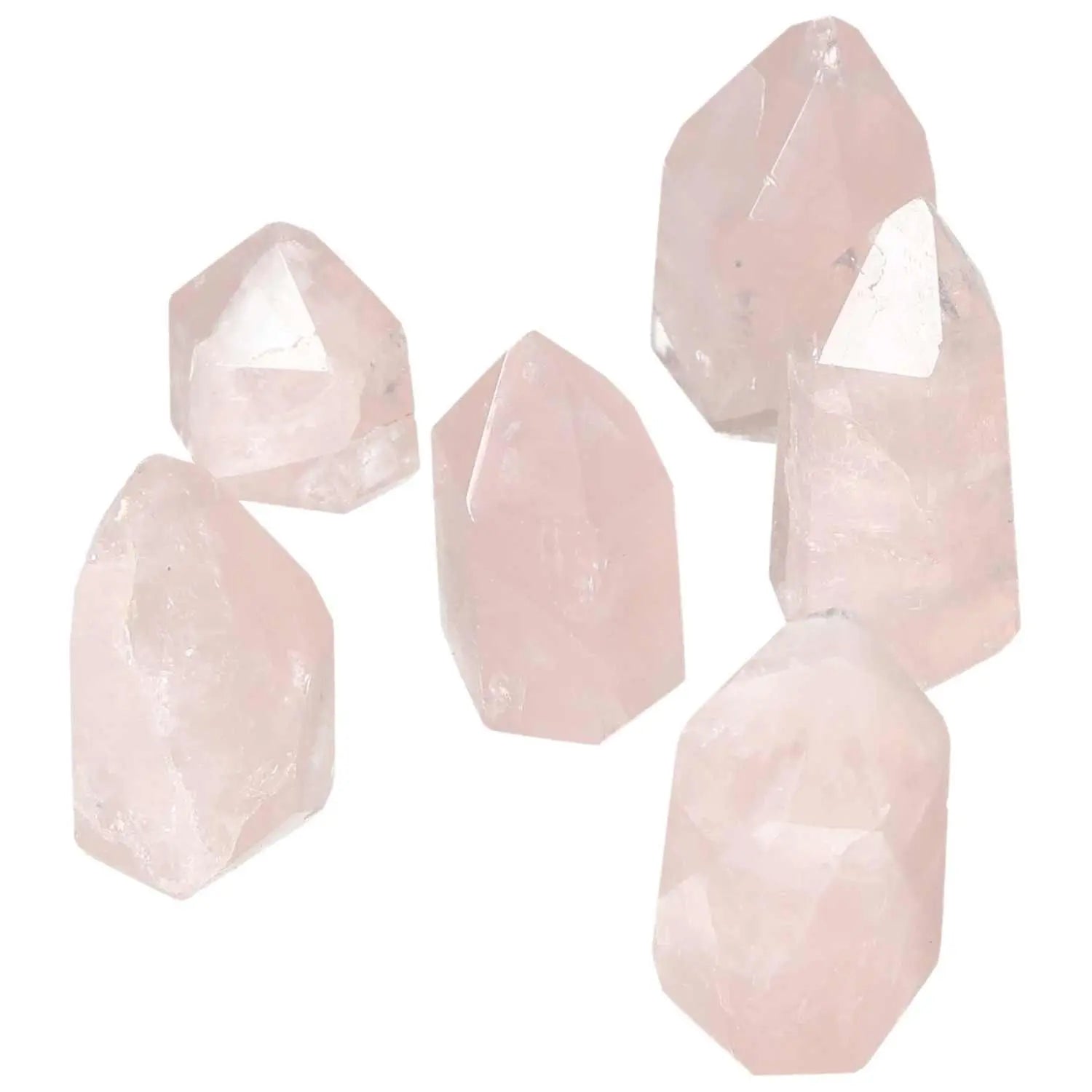 Collection of Polished XS Rose Quartz Obelisks by Sylvia Crystals, enhancing spiritual energy and aesthetic appeal with natural elegance.