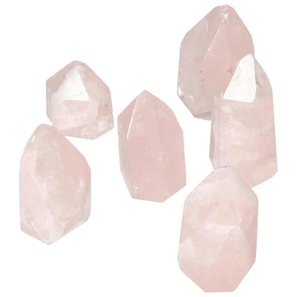 Collection of Polished XS Rose Quartz Obelisks by Sylvia Crystals, enhancing spiritual energy and aesthetic appeal with natural elegance.