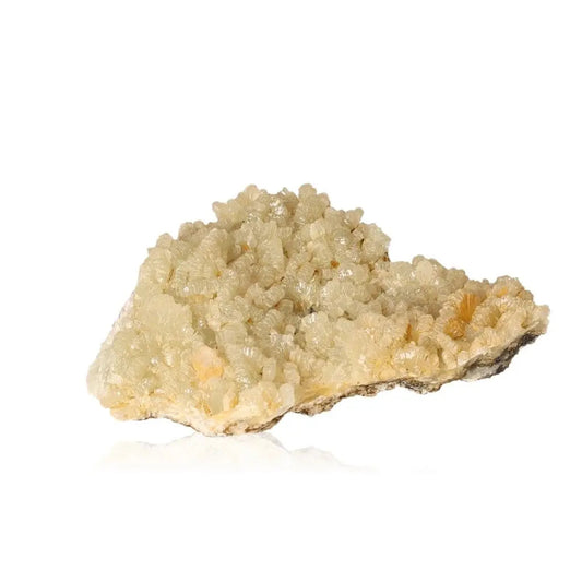 Translucent prehnite druzy gemstone with pale yellowish-green hues, known for soothing properties and enhancing spiritual growth.