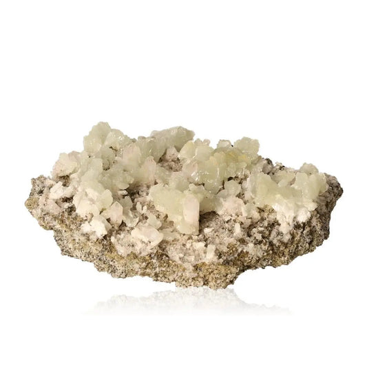 Natural prehnite crystal cluster on a rock base, showcasing pale green translucent gemstones perfect for promoting harmony and spiritual growth.