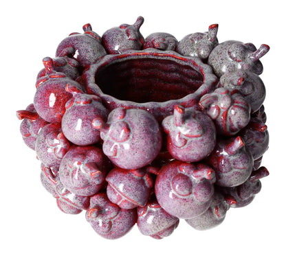 Unique purple earthenware pot with artistic design, perfect for enhancing home decor and adding a touch of elegant style.