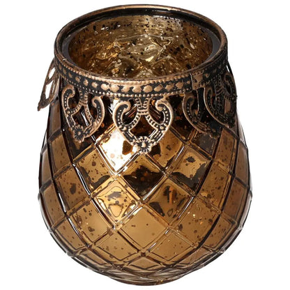 Ornate amber glass lantern with intricate metal rim detailing, showcasing a blend of elegance and luxury in spiritual decor.