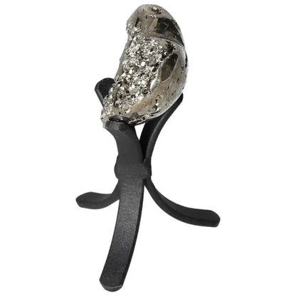 Polished pyrite heart on a black stand, showcasing golden luster and energy-enhancing properties. Ideal for decor and spiritual spaces.