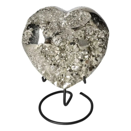 Polished pyrite heart shape with golden luster on stand, showcasing grounding energy and elegant design.