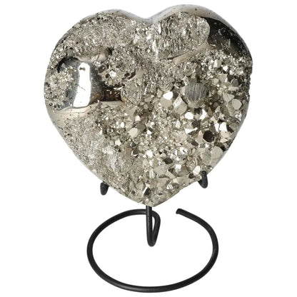 Polished pyrite heart sculpture with golden luster on a stand, showcasing radiant energy and grounding power.