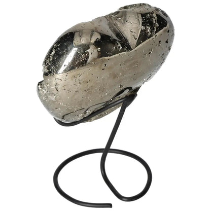 Polished pyrite heart on a metal stand, showcasing its golden luster and grounding energy for decorative and spiritual purposes.