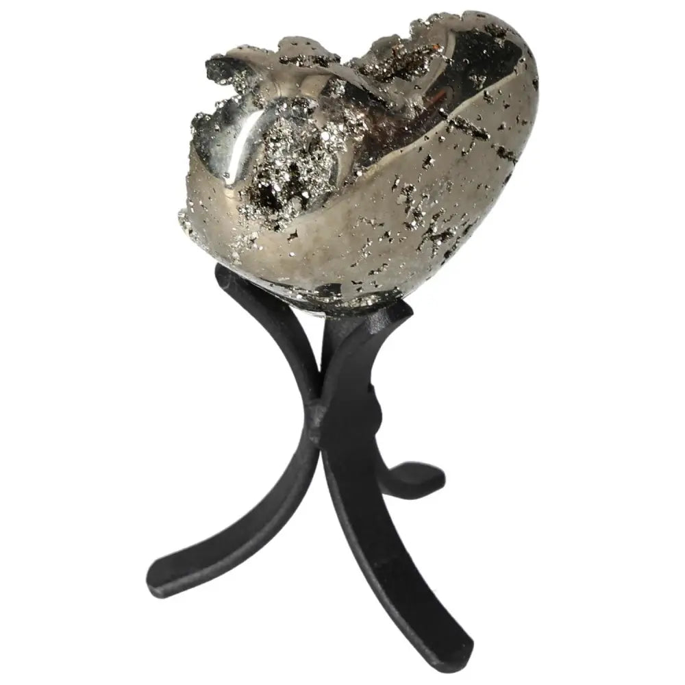 Polished pyrite heart shape showcasing golden luster, set on a stand, enhancing space with radiant energy and elegance.
