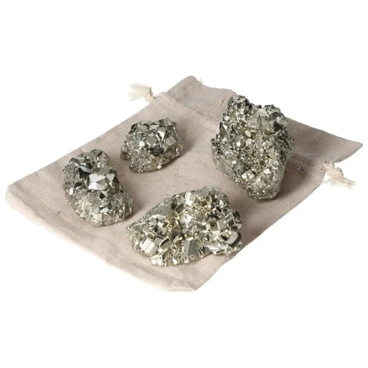 Rough pyrite clusters on fabric bag showcasing geometric formations and metallic luster, premium quality, 1 kg, 2 pieces.