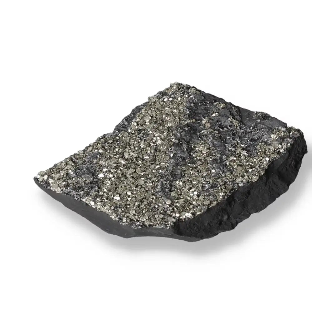 Sparkling pyrite crystals embedded in black basalt stone, showcasing the fusion of grounding and dynamic energies from Sylvia Crystals.