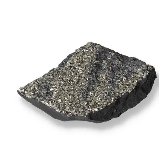 Sparkling pyrite crystals embedded in black basalt stone, showcasing the fusion of grounding and dynamic energies from Sylvia Crystals.