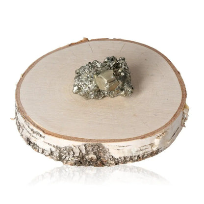 Pyrite druzy on a wooden base, showcasing its golden hue and metallic luster, symbolizing abundance and prosperity.